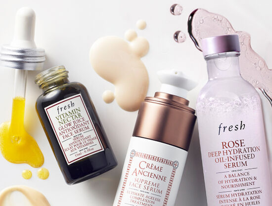 Fresh's advent calendar gift set open to display a selection of products against a light blue background